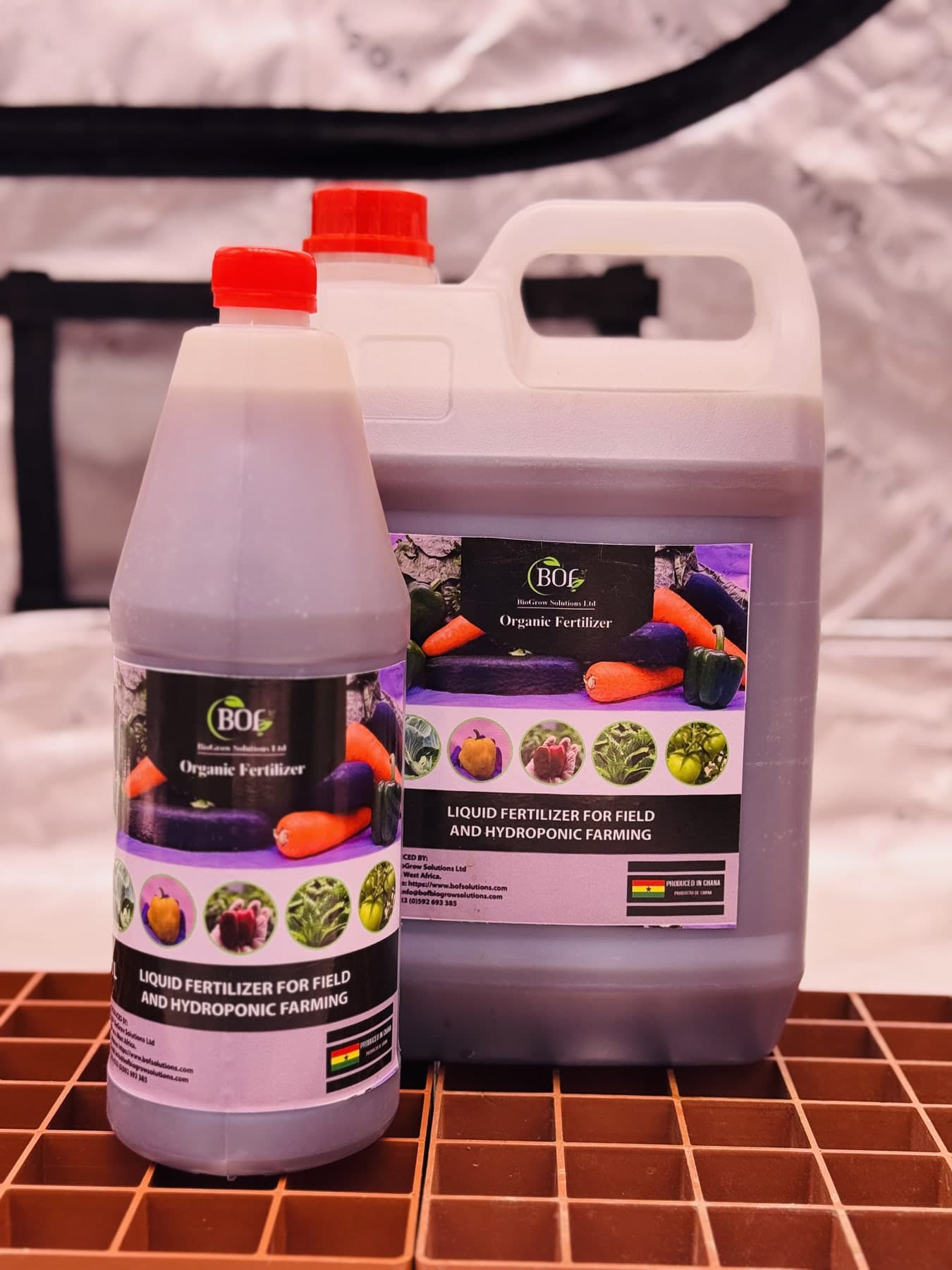 BOF organic fertilizer in a bottle and larger container